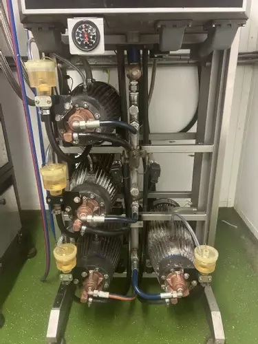 Delta Booster multi-pump pressure washer system after a full service in Brownhills, restored to optimal performance with all pumps checked, serviced, and running efficiently for continuous industrial use.